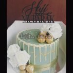 White Flowers Cake With Black Topper