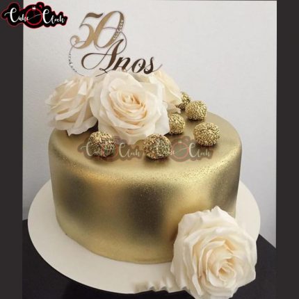 beautiful gold cake with white flowers