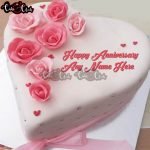 white and pink flowers anniversary cake